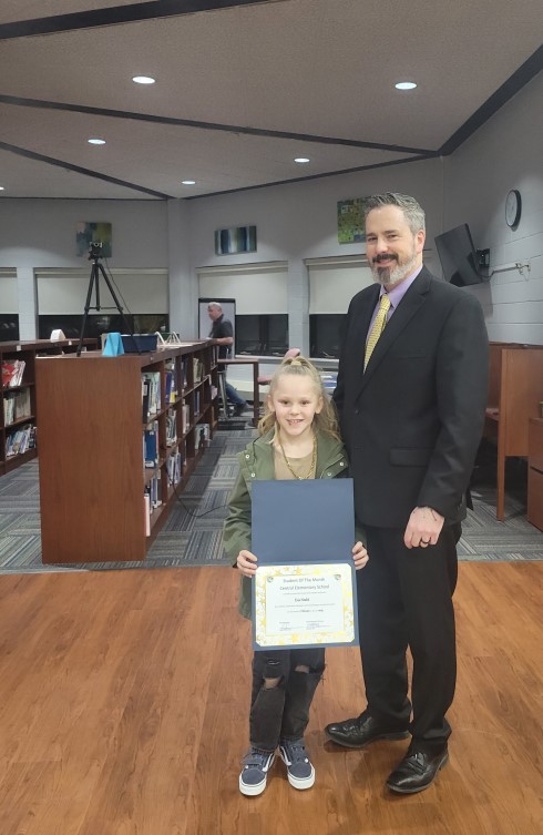 Photo of the February 2023 student of the month for Central Elementary school Evie Nesbit with the principal