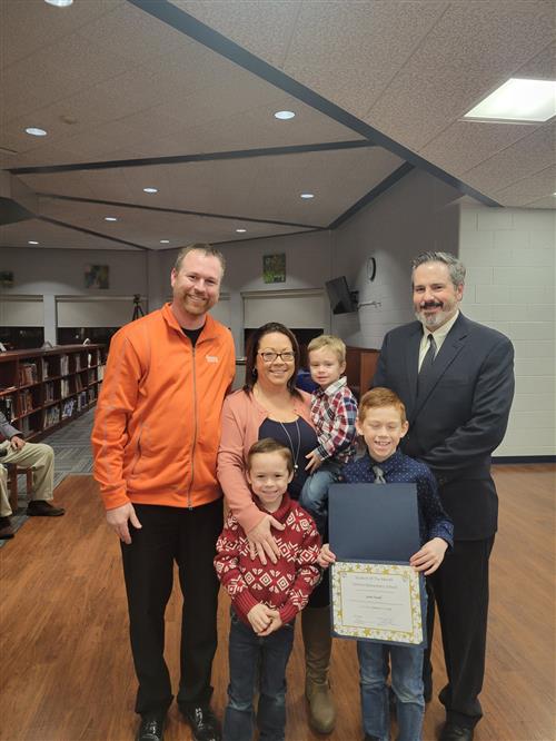 Photo of January 2023 student of the month for Central Elementary School Jaxen Howell with family and principal